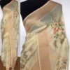 Cream Linen Silk Saree with Beautiful Prints along with Antique Zari Border