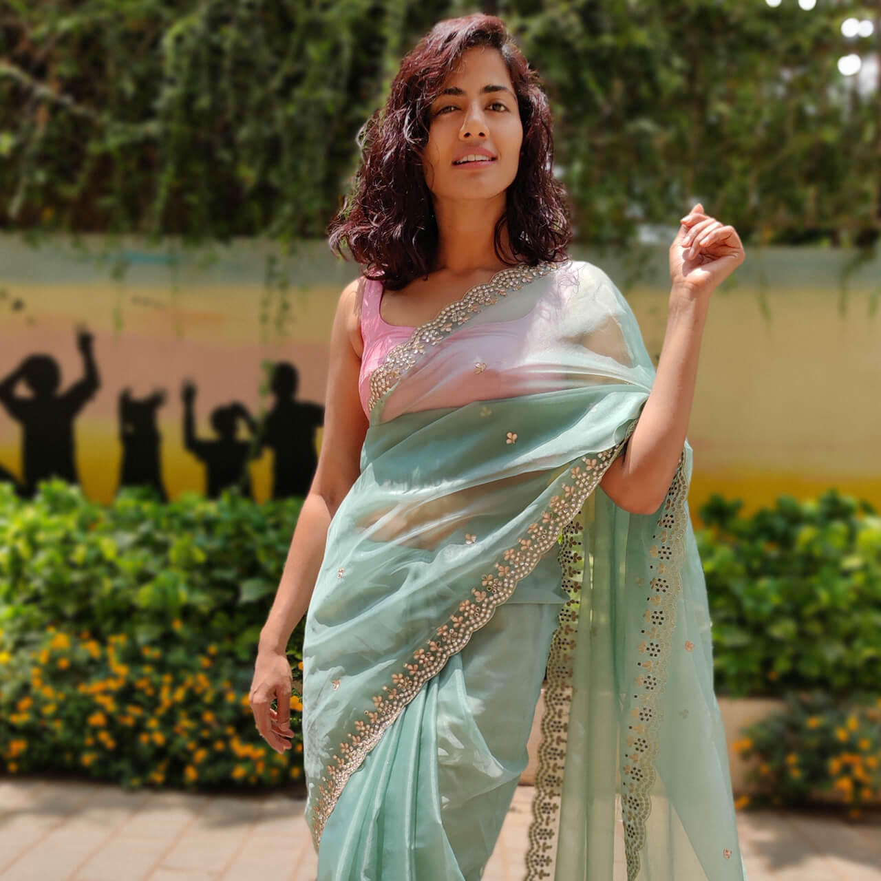 Exude splendidness at your after-sunset celebrations donning this dark  green organza saree styled with a