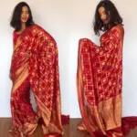Scarlet Red Banarasi Silk Saree in Georgette adorned with Gold Zari Motifs