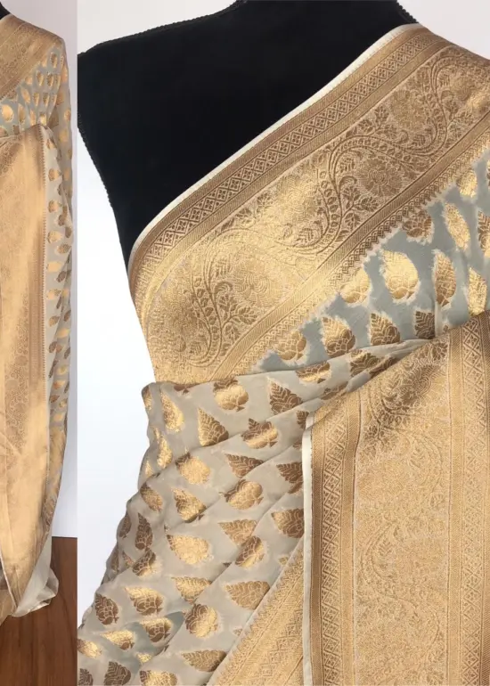 Ivory Banarasi Silk Saree in Georgette adorned with Gold Zari Motifs
