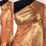 Peach  Tissue Silk Saree with Gold and Silver Zari Buttas