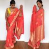 Peach Organza Saree with Gold Zari Weaves highlighted with Beautiful Gota Edging