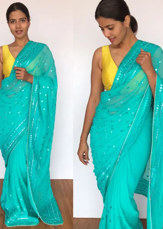 Turquoise Georgette Saree with Mirror Work and highlighted with Gota Work Border