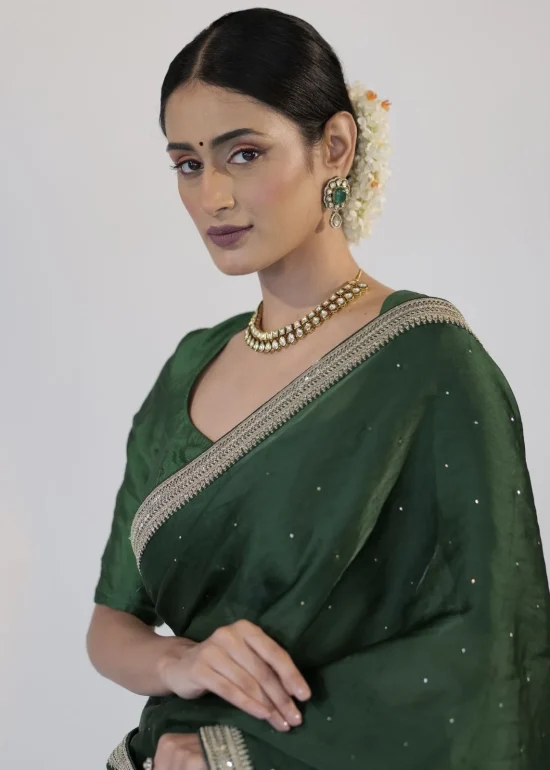 Bottle Green Organza Silk Saree with Embroidery Border adorned with Badla work