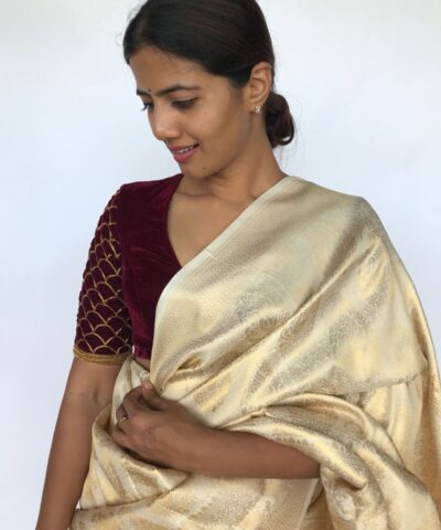 Ivory Banarasi Silk Saree adorned with Paisley Motifs