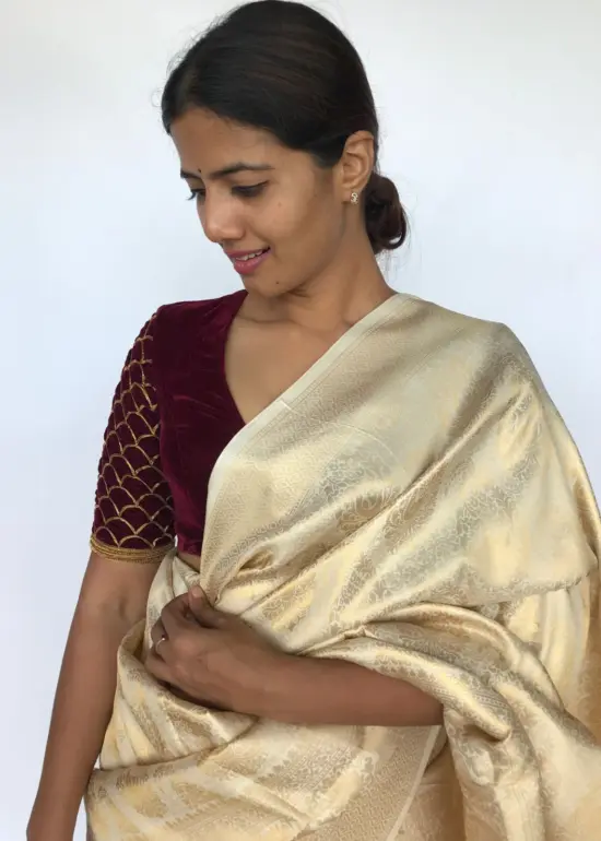Ivory Banarasi Silk Saree adorned with Paisley Motifs