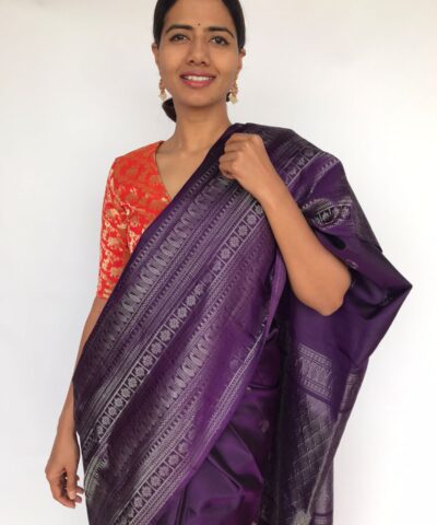 Eggplant Purple Kanjivaram Silk Saree adorned with Paisley Buttas