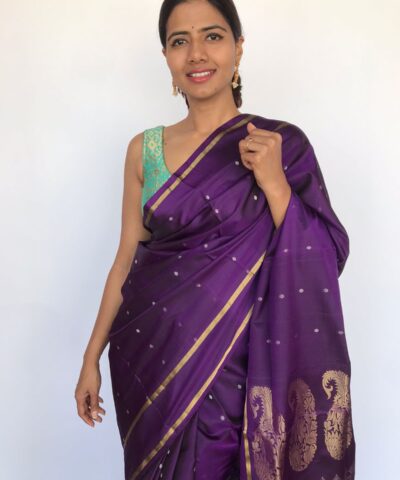 Purple Kanjivaram Silk Saree woven in Silver Zari Buttis highlighted in Gold Zari Edging