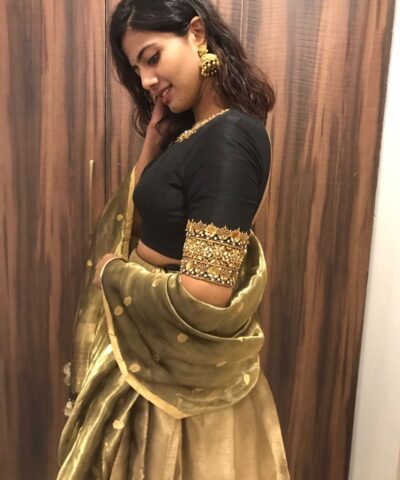 Black Silk Lehenga with contrast border adorned with zari motifs