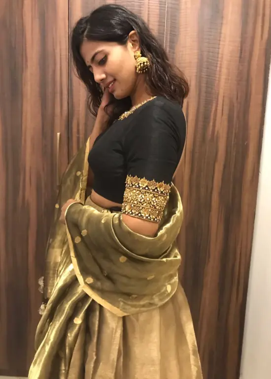 Black Silk Lehenga with contrast border adorned with zari motifs