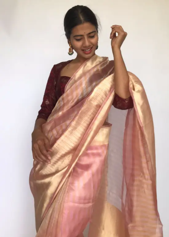 Powder Pink Tissue Silk Saree with  Resham Zari Weaves highlighted with Jacquard Zari Border