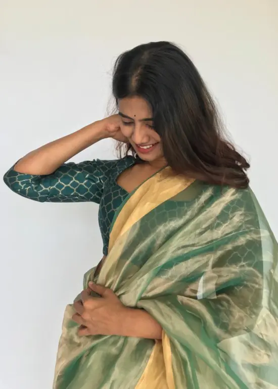 Sea Green Tissue Organza Silk Saree highlighted with Gold Zari Edging