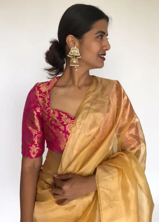 Golden Yellow Tissue Organza Silk Saree highlighted with Gold Zari Edging