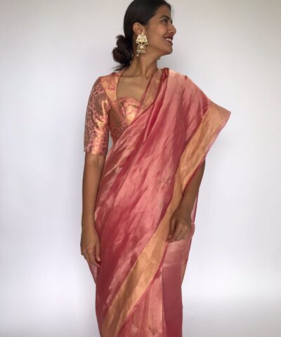 Pink Tissue Organza Silk Saree highlighted with Gold Zari Edging