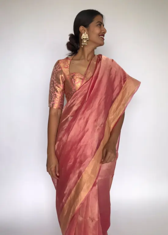 Pink Tissue Organza Silk Saree highlighted with Gold Zari Edging