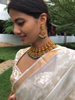 Premium Gold Alike Lakshmi Neckpiece Set adorned with Kemp Stones