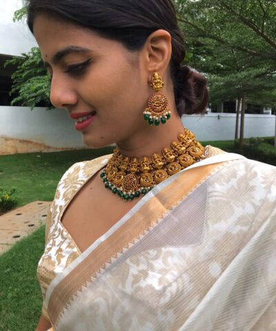 Premium Gold Alike Lakshmi Neckpiece Set adorned with Kemp Stones