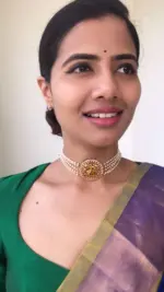 Pearl Choker with Pakshi Pendant highlighted with White Stones
