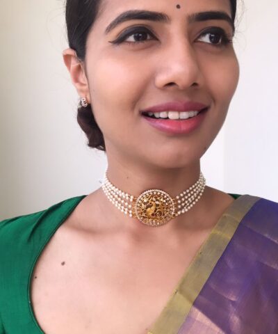 Pearl Choker with Pakshi Pendant highlighted with White Stones