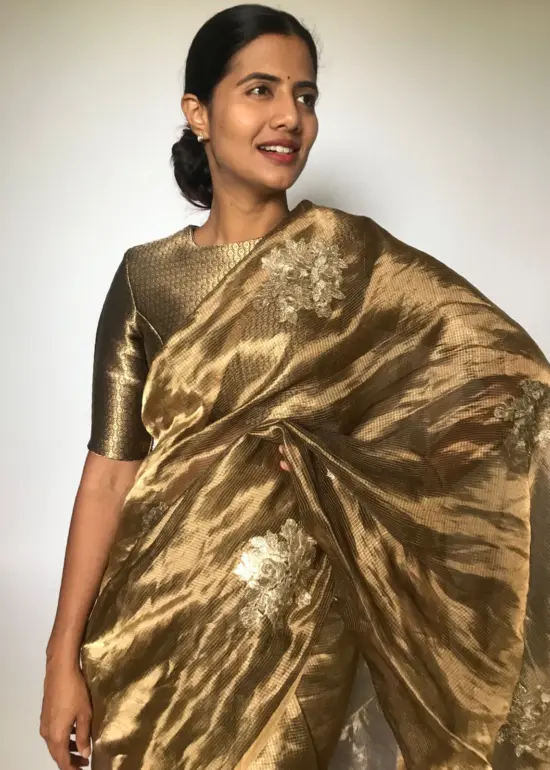 Metallic Tissue Silk Saree highlighted with Floral  Embroidery