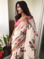 Ivory Printed Linen Saree adorned with Zari and contrast pink piping