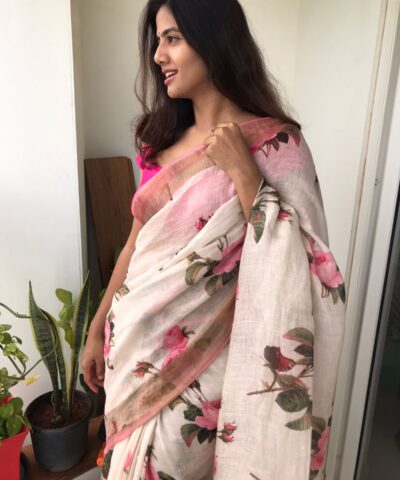 Ivory Printed Linen Saree adorned with Zari and contrast pink piping