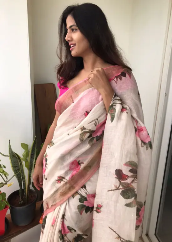 Ivory Printed Linen Saree adorned with Zari and contrast pink piping