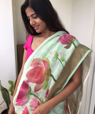 Sea Green Printed Linen Saree adorned with Zari Weaves