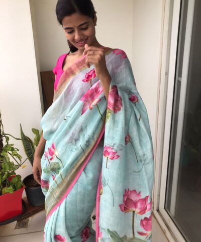 Baby Blue Printed Linen Saree adorned with Zari Weaves
