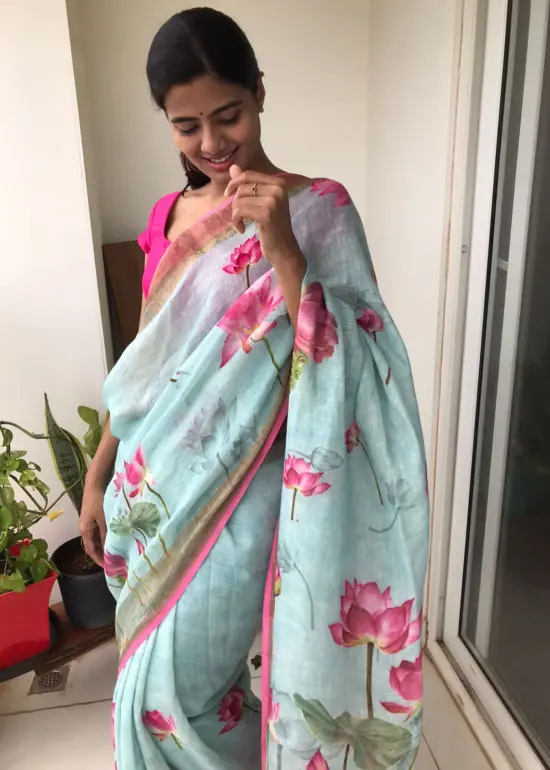 Baby Blue Printed Linen Saree adorned with Zari Weaves