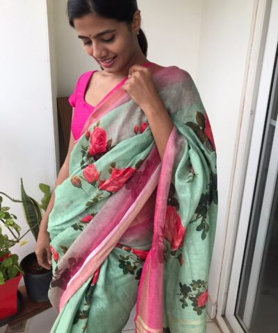 Sea Green Printed Linen Saree adorned with Zari Weaves