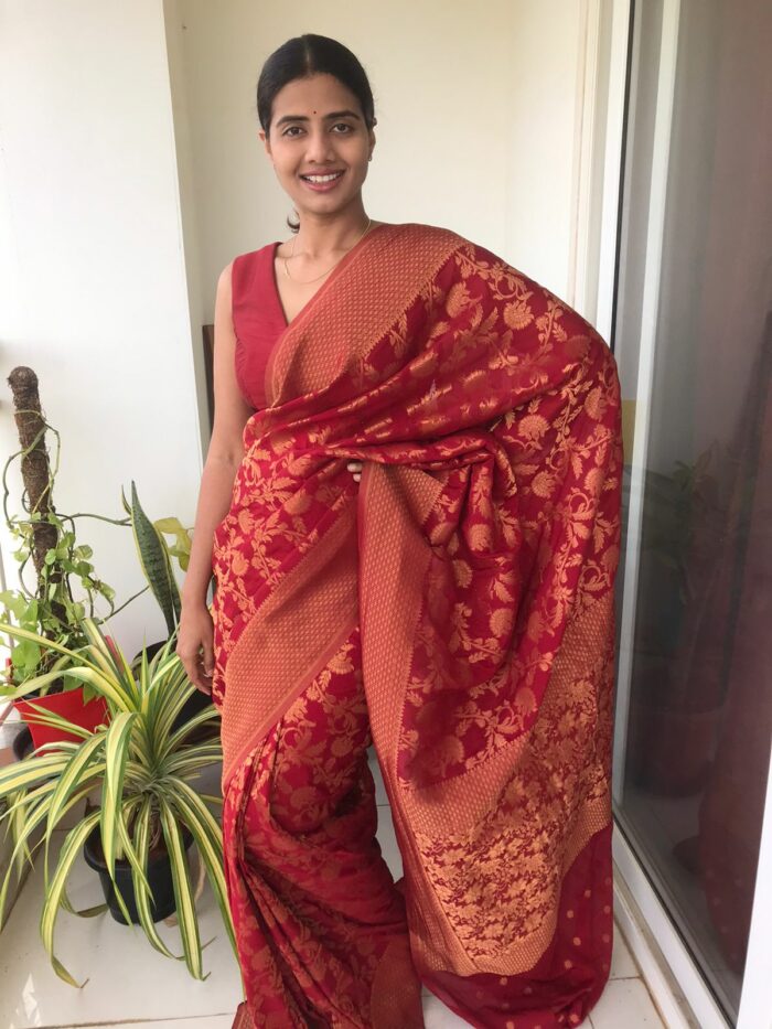 Maroon Chiffon Saree highlighted with Antique Gold Zari Weaves
