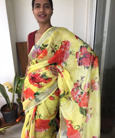Lemon Yellow Printed Linen Saree adorned with Zari Weaves