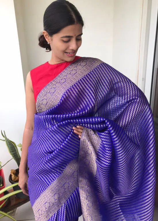 Royal Blue Organza Saree highlighted with Gold Weaves