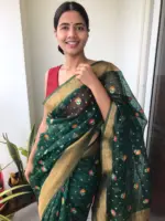 Bottle Green Organza Saree highlighted with Gold Zari and Meenakari Weaves