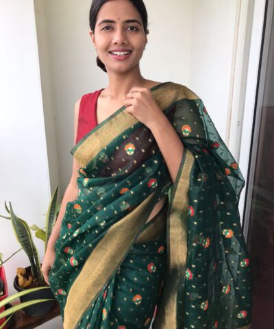 Bottle Green Organza Saree highlighted with Gold Zari and Meenakari Weaves
