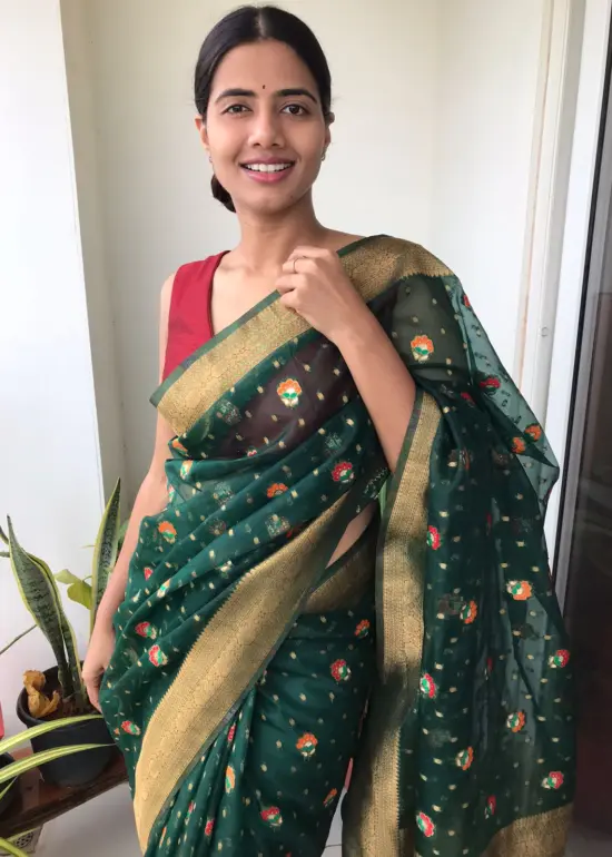 Bottle Green Organza Saree highlighted with Gold Zari and Meenakari Weaves