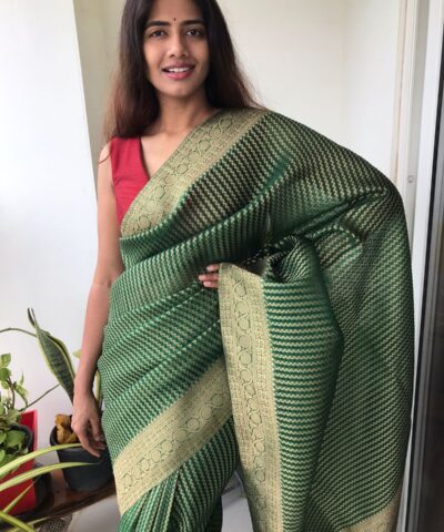 Bottle Green Organza Saree highlighted with Gold Weaves
