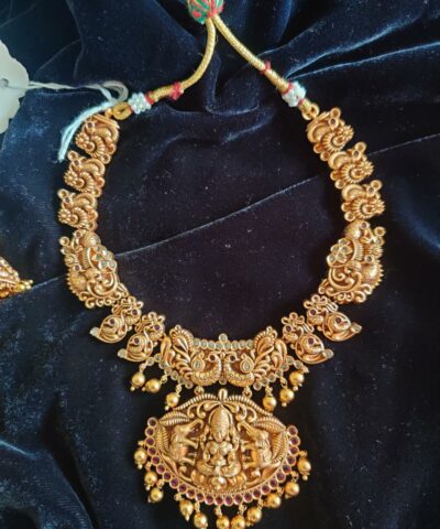 Antique Premium Gold Necklace Adorned with Lakshmi Goddess, White and Red Kemp Stones