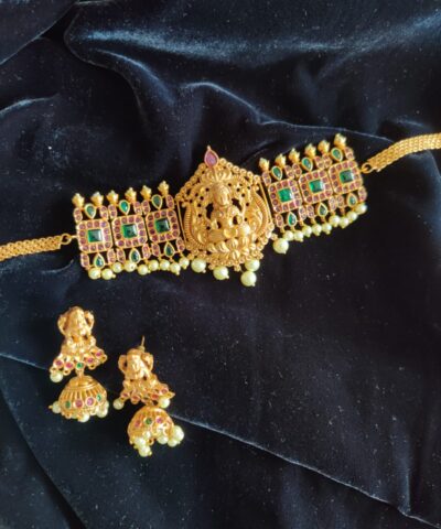 Matte Gold Choker Necklace Adorned with Lakshmi Goddess, Green and Red Kemp Stones