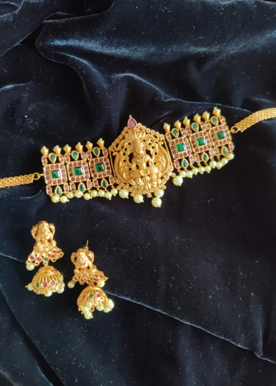 Matte Gold Choker Necklace Adorned with Lakshmi Goddess, Green and Red Kemp Stones