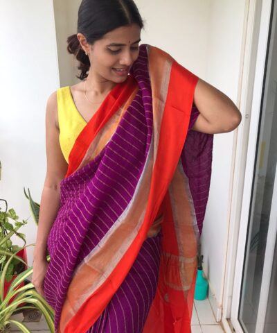 Purple Chiffon Silk Saree highlighted with Striped Body and contrast edging