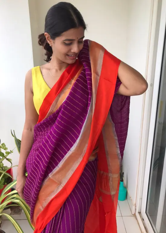 Purple Chiffon Silk Saree highlighted with Striped Body and contrast edging
