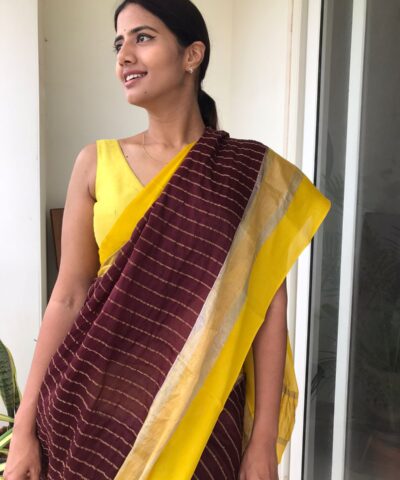 Brown Chiffon Silk Saree highlighted with Striped Body and contrast edging