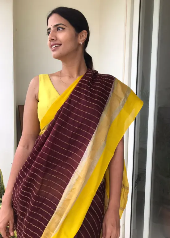 Brown Chiffon Silk Saree highlighted with Striped Body and contrast edging