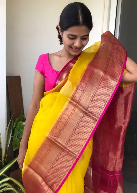 Yellow Organza Silk Saree highlighted with Kanchi Zari Border