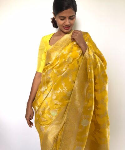 Golden Yellow Tissue Georgette Saree highlighted with Jaquard Gold Zari Weaves