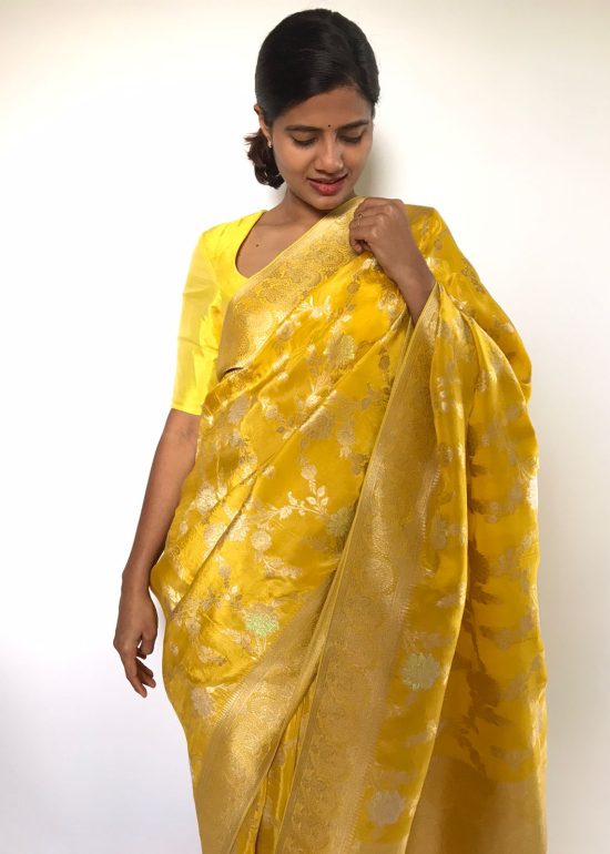Golden Yellow Tissue Georgette Saree highlighted with Jaquard Gold Zari Weaves