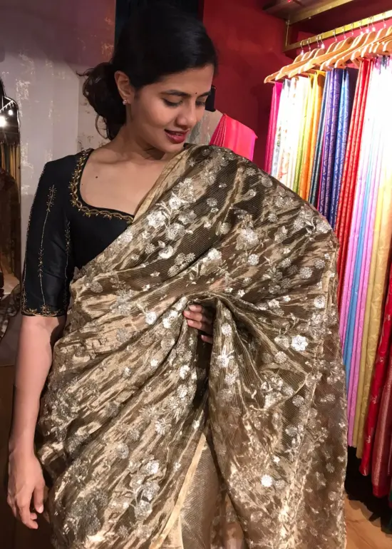 Metallic Tissue Silk Saree highlighted with Floral Embroidery