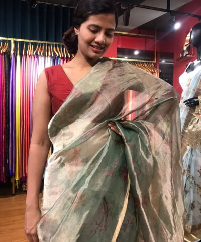 Sea Green Printed Tissue Silk Saree highlighted with Gold Piping